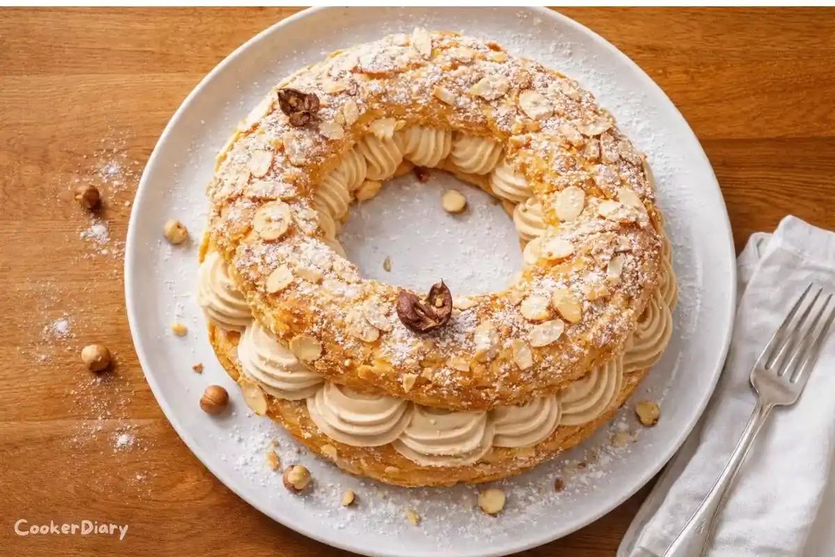 Top-down view of Paris-Brest with golden choux ring and hazelnut cream filling.
