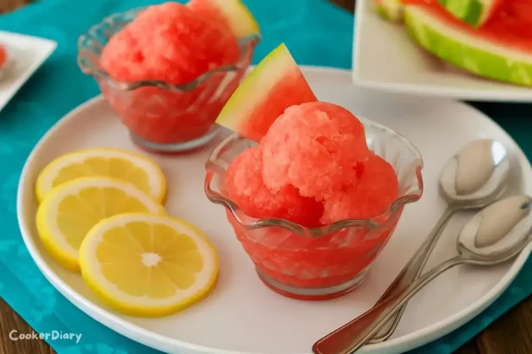 Glasses of watermelon sorbet garnished with lemon slices and mint leaves