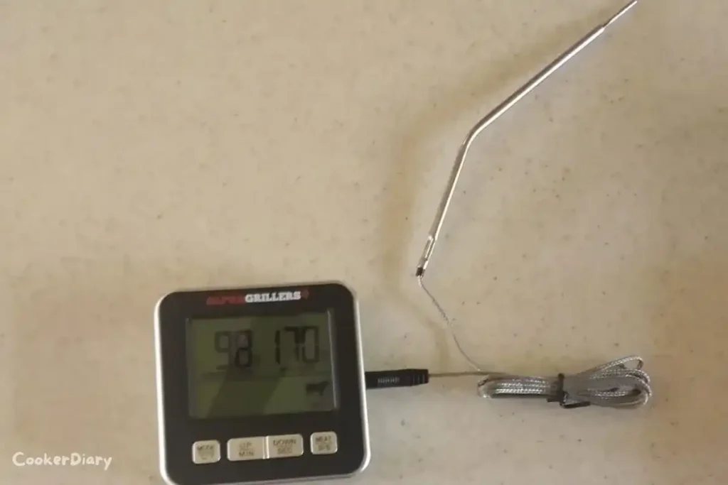 Alpha Grillers digital meat thermometer designed for oven use showing temperature on a clear LCD display