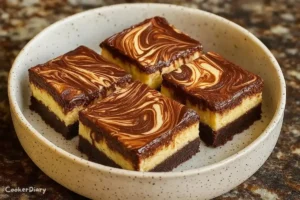 Nutella cheesecake bars with creamy chocolate filling and a biscuit crust, cut into squares on a plate