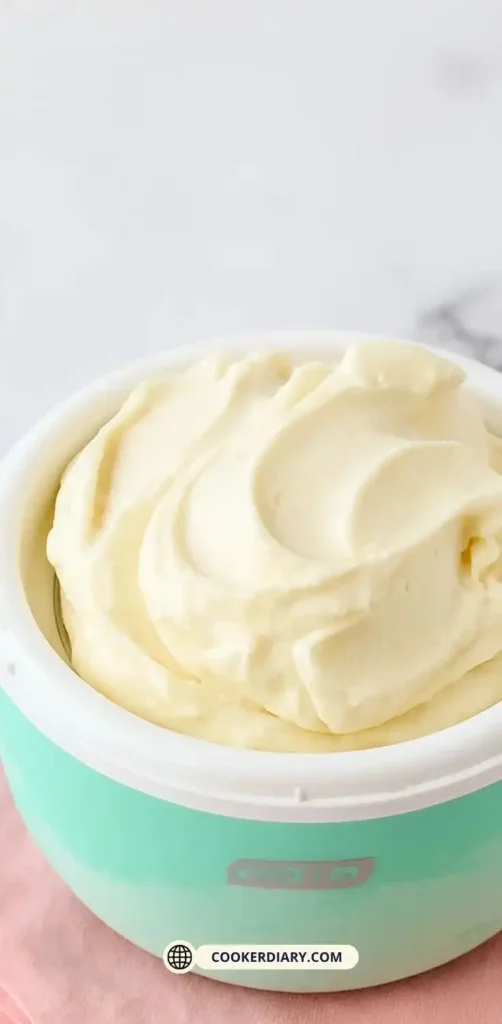 Homemade vanilla ice cream served in a ceramic mug made with DASH My Mug Ice Cream Maker on a kitchen countertop