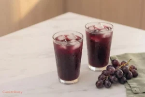 Two glasses of chilled cold pressed grape juice served over ice
